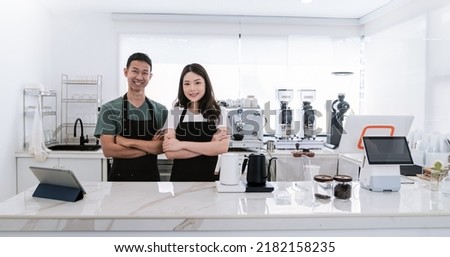 Startup successful small business owner sme boy girl stand with tablet in coffee shop restaurant. Portrait of asian tan man woman barista cafe owner. SME entrepreneur seller business delivery concept
