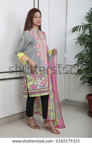A Pakistani girl is standing with style.