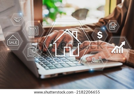 Businessman using laptop to search, Planning and investing in real estate, Property management concept Royalty-Free Stock Photo #2182206655
