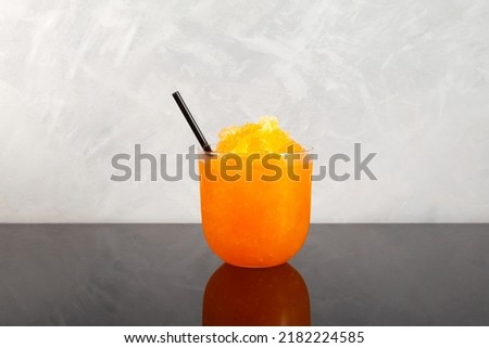 Slushie drink. Orange Granizado. Refreshing summer iced drink. Sweet Shaved ice with natural orange juice. Royalty-Free Stock Photo #2182224585