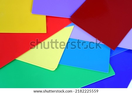 Blue,red,green,yellow,orange,black,navy blue painted metal plates on a white background. Painted with powder coatings