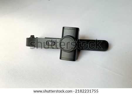 A simply phone holder gimbal isolated on white background high key