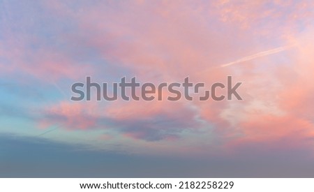 Very gentle romantic pink clouds in the dawn sky. tender mood Sunrise Sundown Sunset sky panoramic image Royalty-Free Stock Photo #2182258229