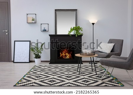 Stylish living room interior with decorative fireplace
