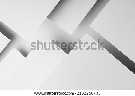 White abstract geometric background with fly white surfaces as monochrome stylish pattern with triangles, corners, diagonal stripes, lines and shadows in elegant simple modern minimal style.