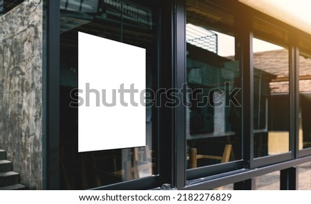 White paper poster mockup displayed outside the building restaurant. Marketing and business concept.  Royalty-Free Stock Photo #2182276829