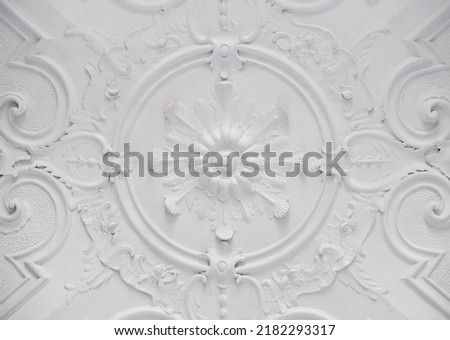 Decorative item ceiling socket made of white plaster. Relief stucco interior Royalty-Free Stock Photo #2182293317