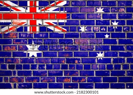 National  flag of the New Zealand on a grunge brick background.
