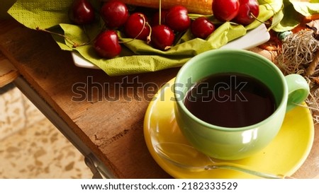 cherries and pastas with tea set in green and yellow colour, product picture