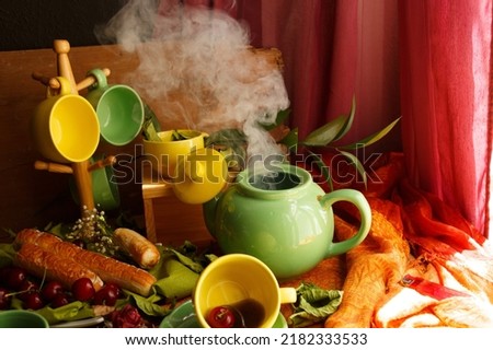 Coffee and tea set with cherries and pastries in green and yellow, product picture