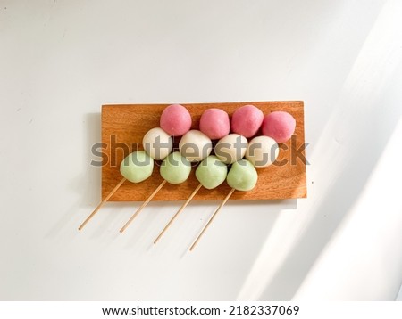 hanami dango is a typical Japanese street food that is sold during the spring festival celebration made from glutinous rice flour