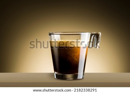 Black coffee in glass cup on brown background Royalty-Free Stock Photo #2182338291