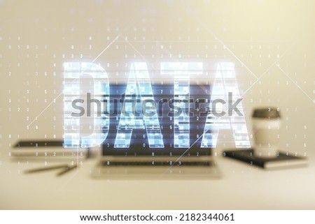 Creative Data word hologram on modern laptop background, big data and blockchain concept. Multiexposure