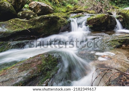 Water flowing around rocks in Wicklow, Ireland