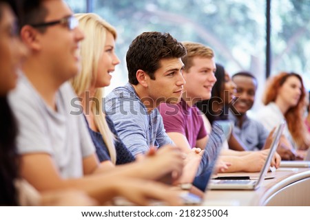 Class Of University Students Using Laptops In Lecture Royalty-Free Stock Photo #218235004