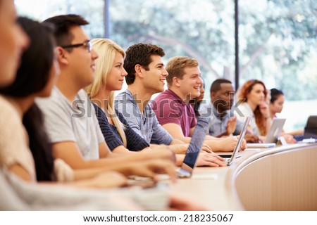 Class Of University Students Using Laptops In Lecture Royalty-Free Stock Photo #218235067