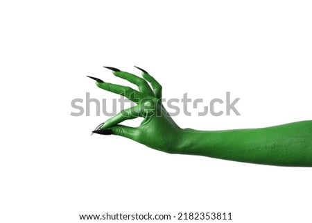 Halloween green color of witches, evil or zombie monster hand isolated on white background. Royalty-Free Stock Photo #2182353811
