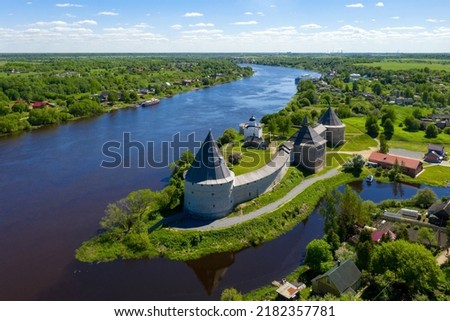 Aerial view of Ladoga fortress and Volkhov river on sunny summer day. Staraya Ladoga, Leningrad Oblast, Russia. Royalty-Free Stock Photo #2182357781