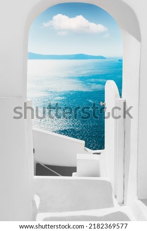 White architecture on Santorini island, Greece. Summer seascape. View of the sea and the blue sky with white cloud. Travel and summer vacations concept