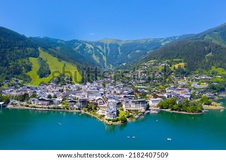 View over lake Zeller to Zell am See town. Beautiful panorama of Zell am See in Tirol Alps in Austria. Royalty-Free Stock Photo #2182407509