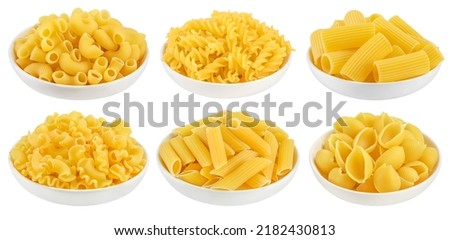 Uncooked dried conchiglie in ceramic bowl. Raw organic shell pasta isolated on white bachground with clipping path and full depth of field Royalty-Free Stock Photo #2182430813