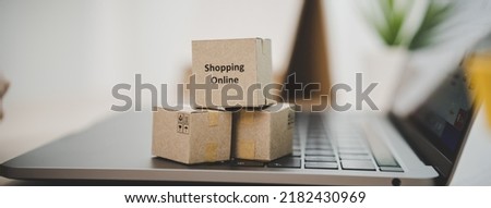 internet shopping e commerce concept, Parcel boxes of product on laptop computer related buy from online store. Royalty-Free Stock Photo #2182430969