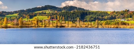 panoramic landscape with lake and forest at autumn