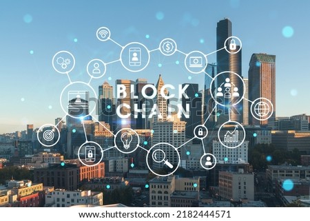Seattle aerial skyline panorama of downtown skyscrapers at sunrise, Washington USA. Decentralized economy. Blockchain, cryptography and cryptocurrency concept, hologram