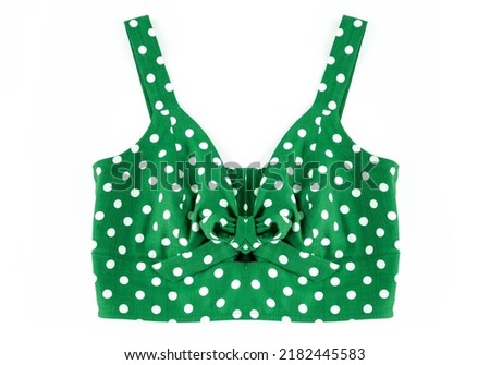 Women's cotton top. Summer clothes. trendy crop top in bright color, isolate on white. Fashion trends 2022 in clothing. Stylish polka dot crop top. Women's textile sconce. High quality photo