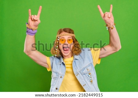 Photo of redhair guy enjoy subculture make horned sign wear stylish trendy jeans vest isolated vibrant color background