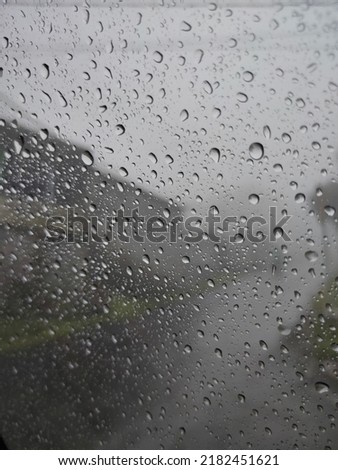Defocus raindrops on the car window in a foggy area
