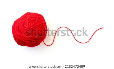 Ball with red yarn and thin rope isolated on white  Royalty-Free Stock Photo #2182472489