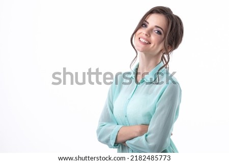 Happy young woman in casual clothes smiling on white background.