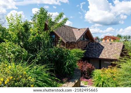 Photo of a chic country house on a sunny day
