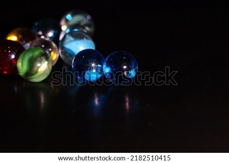 Marbles isolated on a black background.