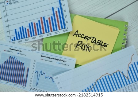 Concept of Acceptable Risk write on sticky notes isolated on Wooden Table.