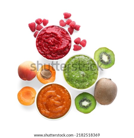 Different puree in bowls and fresh ingredients on white background, top view Royalty-Free Stock Photo #2182518369
