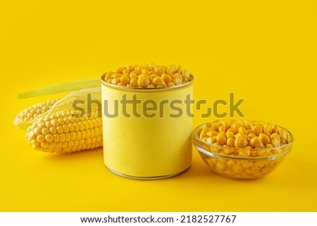 Fresh corn grain on a yellow background. toning. selective focus
