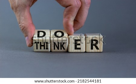 Doer or thinker symbol. Concept words Doer or thinker on wooden cubes. Businessman hand. Beautiful grey table grey background. Business and doer or thinker concept. Copy space. Royalty-Free Stock Photo #2182544181