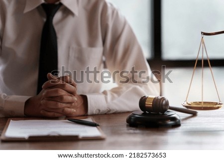 Close up lawyer businessman working or reading agreement contract in office workplace for consultant lawyer concept.