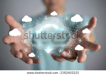 Businessman holding cloud, close-up cloud computing concept of a young businessman with cloud in hand. The concept of cloud services to connect with each other.