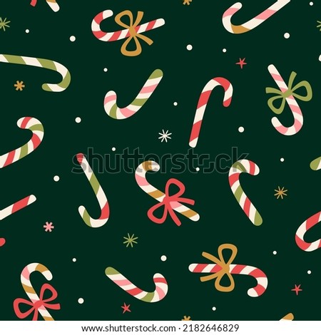 Vector Christamas seamless pattern with Candy Canes. Holiday repeated texture with traditional Christmas sweets. Winter print for fabric and wrapping paper. Royalty-Free Stock Photo #2182646829