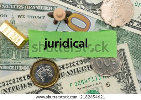 juridical.The word is written on a slip of paper,on colored background. professional terms of finance, business words, economic phrases. concept of economy.