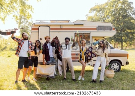 A group of cheerful friends set off on an RV trip. The students have arrived at their destination and are enjoying their time together
