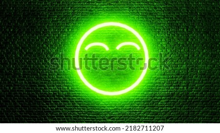 Neon happy face emoji on brick wall. Neon sign. Neon emoji. Happy emoji. Happy face. Smile.