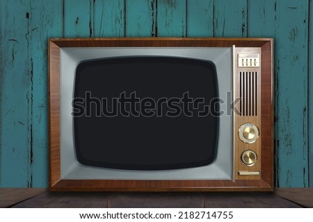 Vintage retro analog TV with blank screen, 1960-1970, concept of obsolescence, modernization or technological revolution, stylish mockup, template for video, background for designer with copy space Royalty-Free Stock Photo #2182714755
