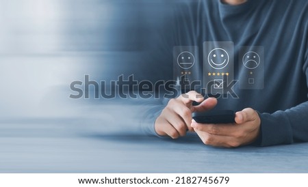 User give rating to service experience on online application, Customer review satisfaction feedback survey concept, Customer can evaluate quality of service leading to reputation ranking of business. Royalty-Free Stock Photo #2182745679