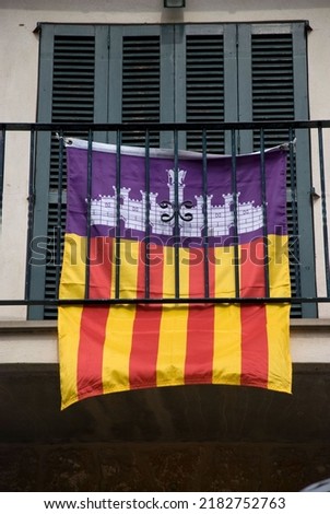 Catalonian flag hanging on balcony of house on Mallorca, Baleares - Spain