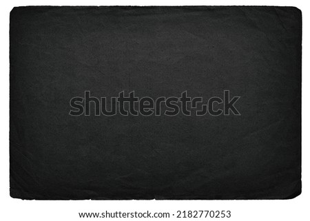 black paper texture on isolated background, darkened cardboard sheet from old waste paper