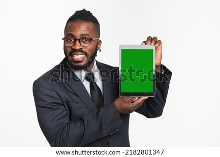 Confident african-american businessman ceo boss leader showing digital tablet green screen for mockup free space copyspace isolated in white background